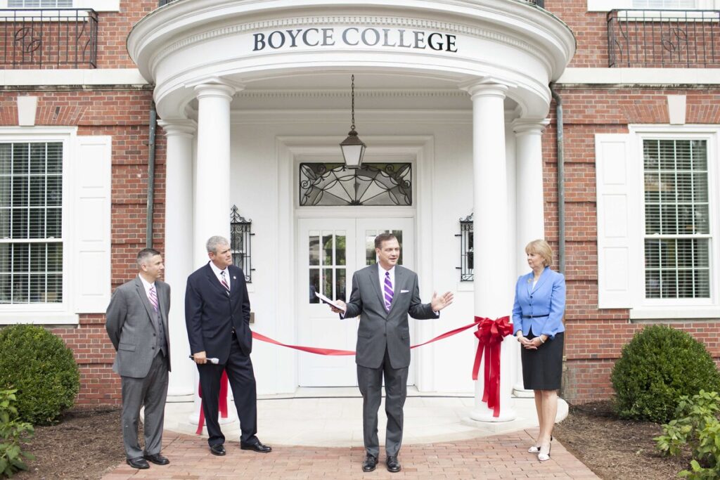 Albert Mohler, standing in front of a building (and college) named in the honor of the slave-holding founder of the SBC.